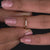 Three stone yellow gold wedding band.
