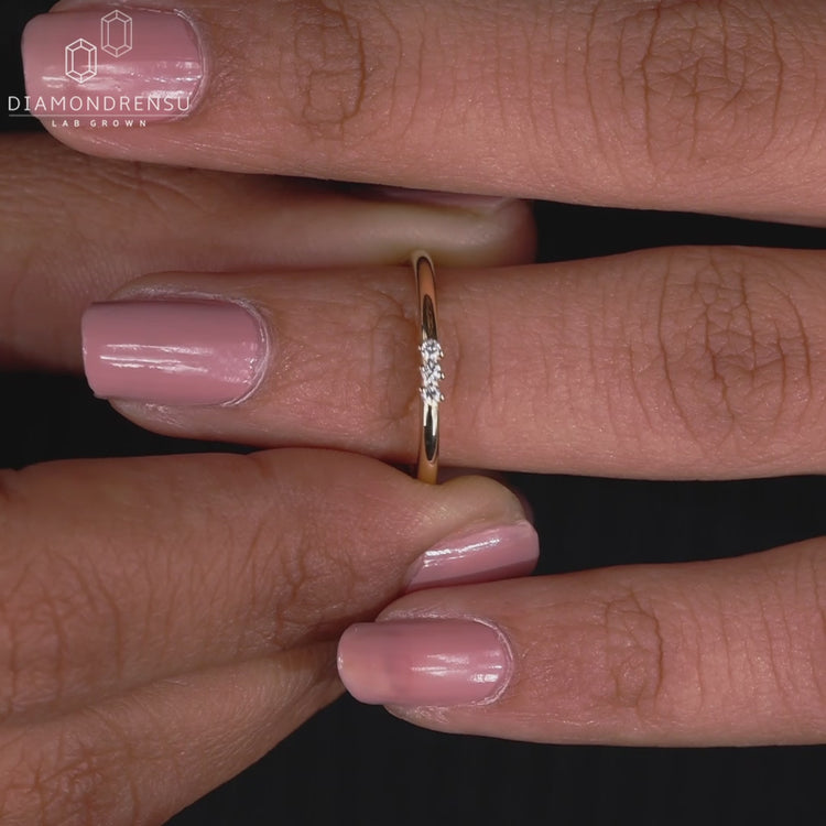 Three stone yellow gold wedding band.
