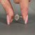 Bezel setting engagement ring with solitaire design.
