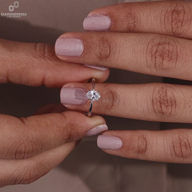 Lab diamond ring with oval solitaire setting.
