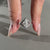 Solitaire diamond engagement ring paired with split shank engagement ring.
