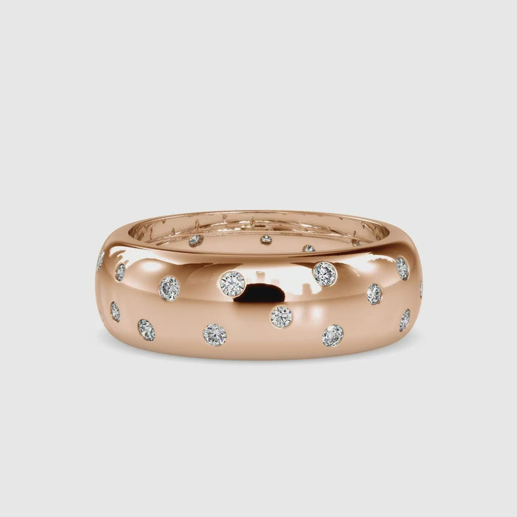 Custom lab grown flush wedding band in rose gold.
