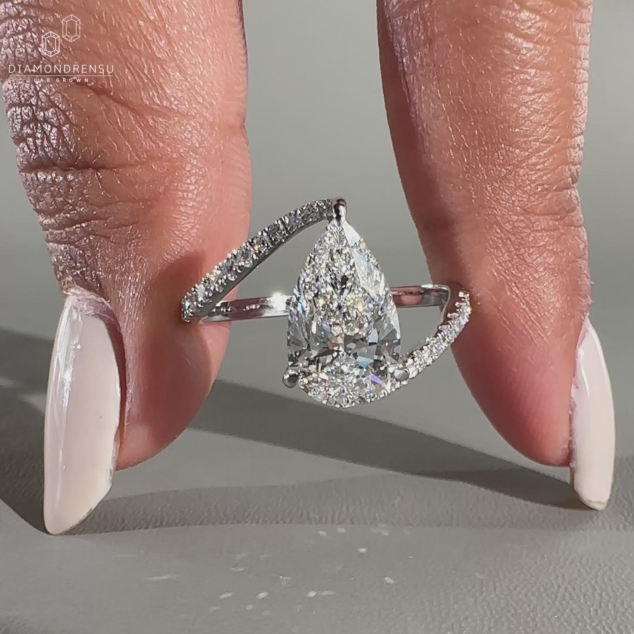 Bypass setting engagement ring with pave setting design.

