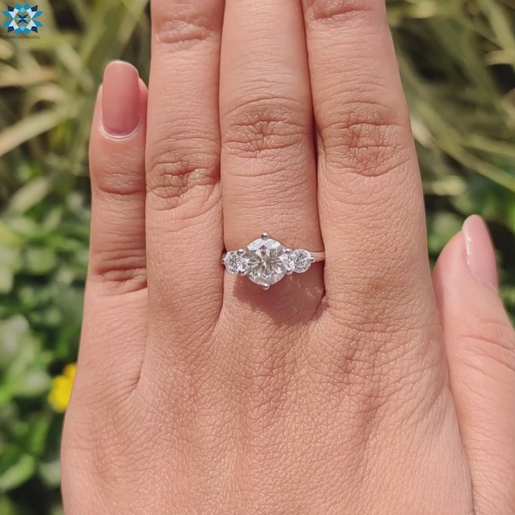 Prong mounted moissanite ring in classic three stone design.
