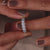 White gold halo set round diamond eternity wedding band
