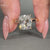 This cushion old mine cut ring features a solitaire diamond ring with cathedral setting ring.
