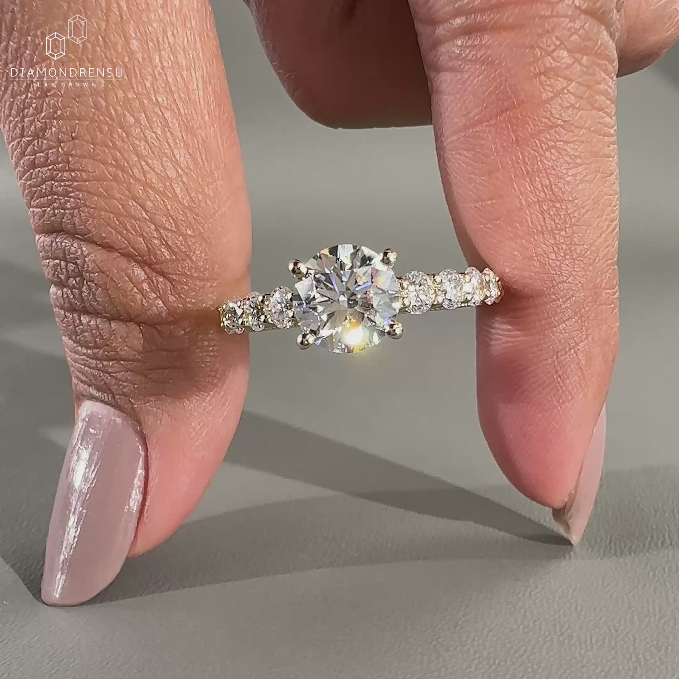 Elegant pave setting ring showcasing a round cut diamond.
