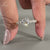 Elegant pave setting ring showcasing a round cut diamond.
