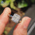 Radiant cut ring in halo setting ring style
