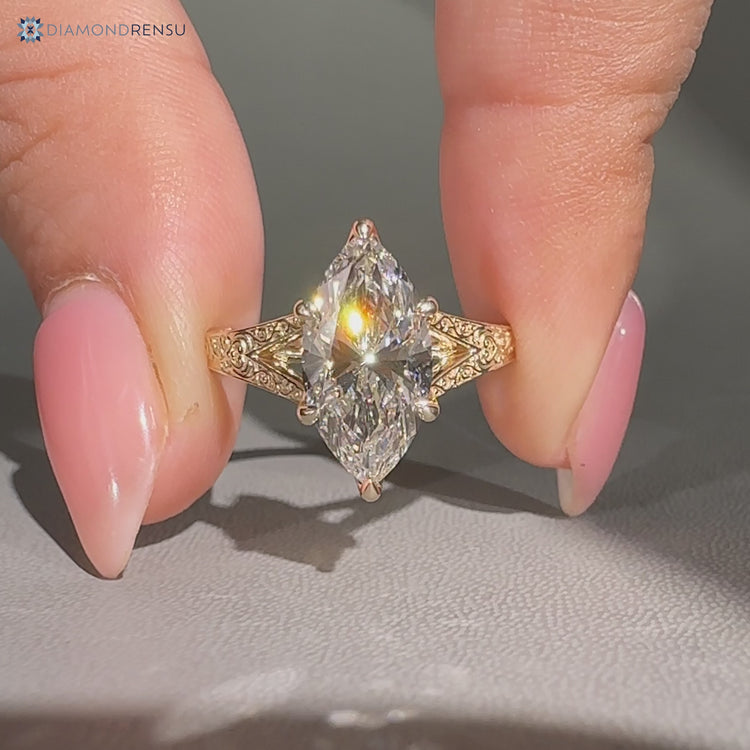 Handmade marquise ring with art deco style details.