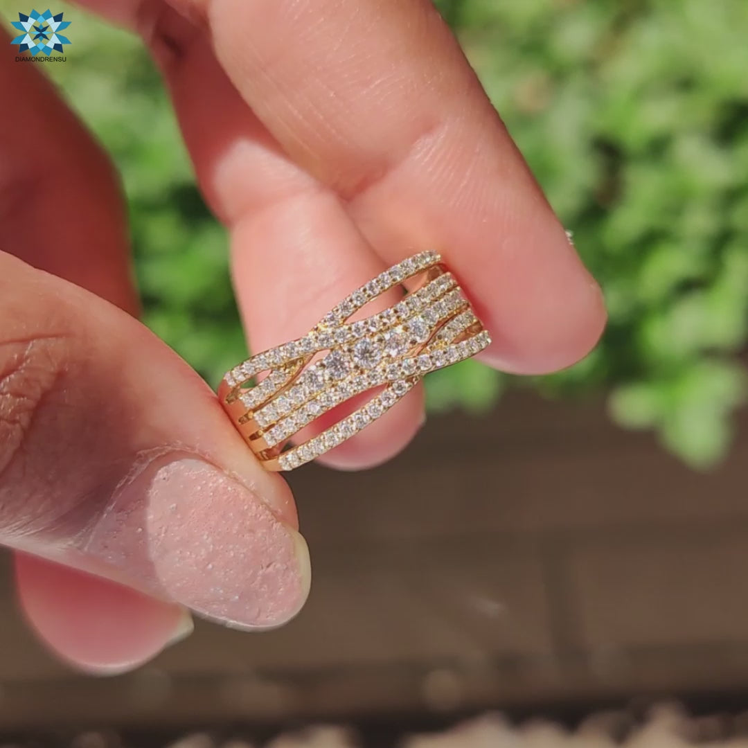 Multi row pave moissanite ring featuring round cut centre stone.
