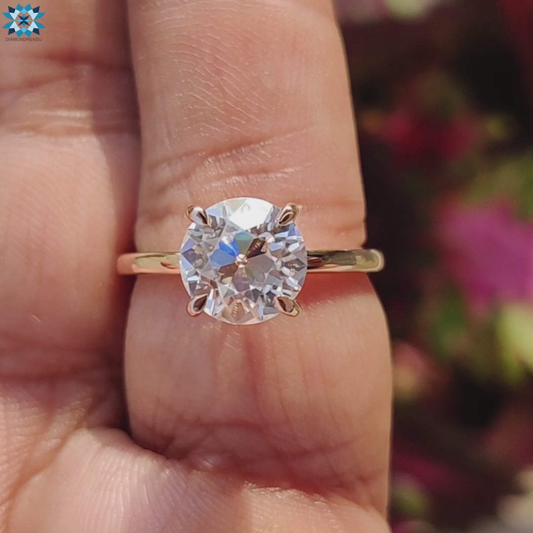 A beautiful moissanite engagement ring featuring a round moissanite center stone, perfect for a unique proposal.
