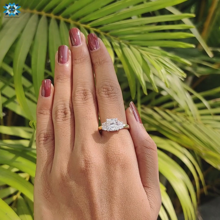 Cushion moissanite three stone ring for UK couples.
