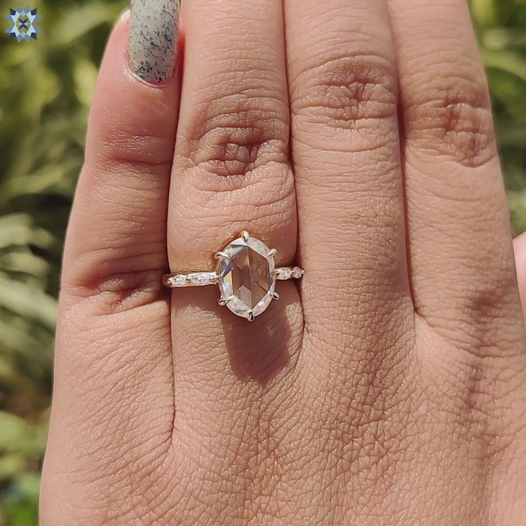 Diamondrensu UK ring with marquise side stones and rose cut center.
