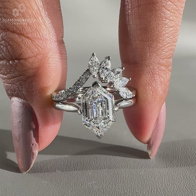 Hexagon step cut ring crafted with a bold compass prong setting.
