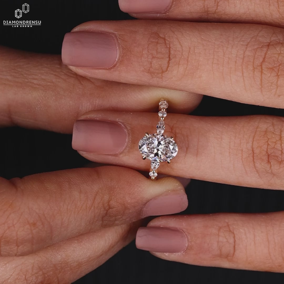 Oval Diamond Ring With Marquise And Round Side Stone