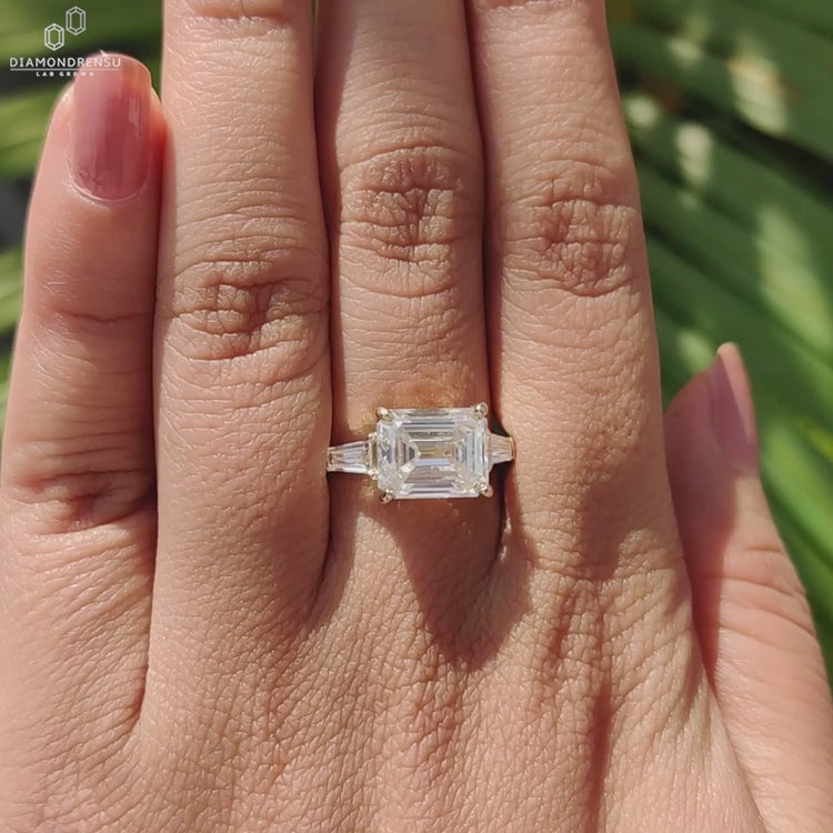 Classic three stone ring with moissanite.
