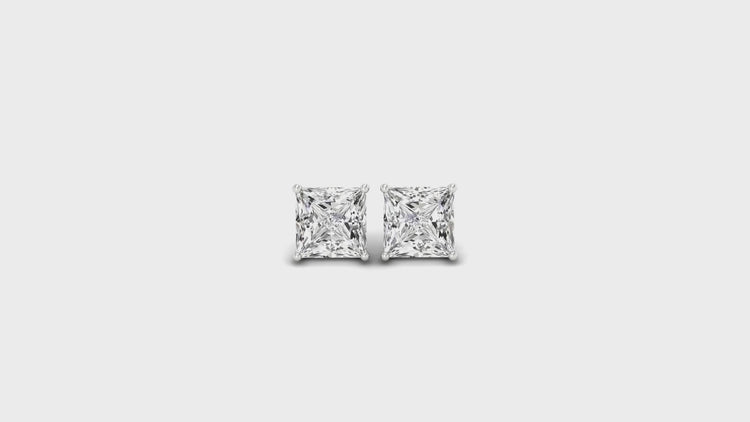 Princess cut diamond stud earrings in white gold with screw back design.
