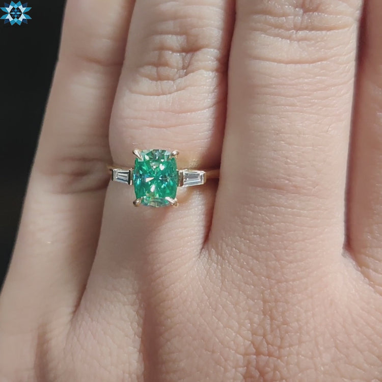 Yellow gold custom ring with blue center moissanite.
