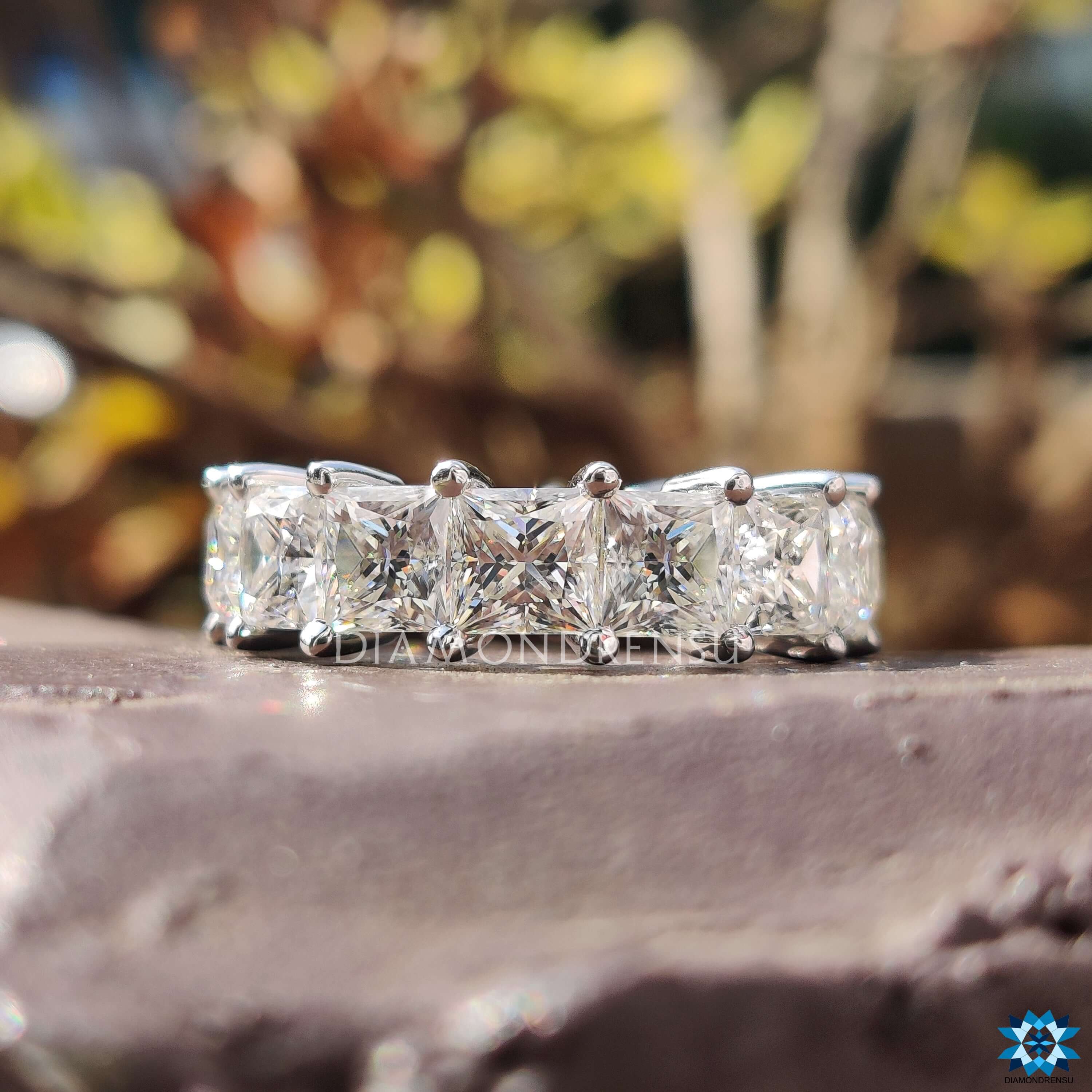 Eternity ring with princess cut diamonds in a luxurious setting.