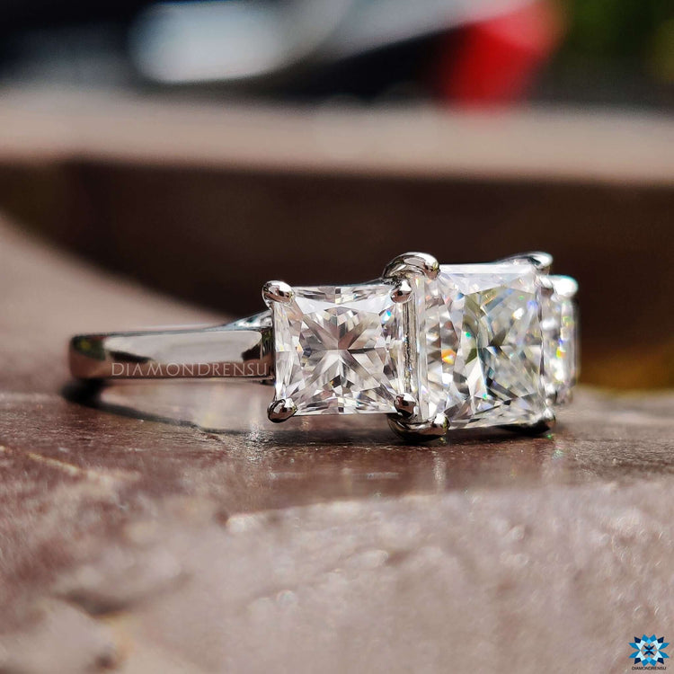 Custom 3 stone ring with trellis setting design.
