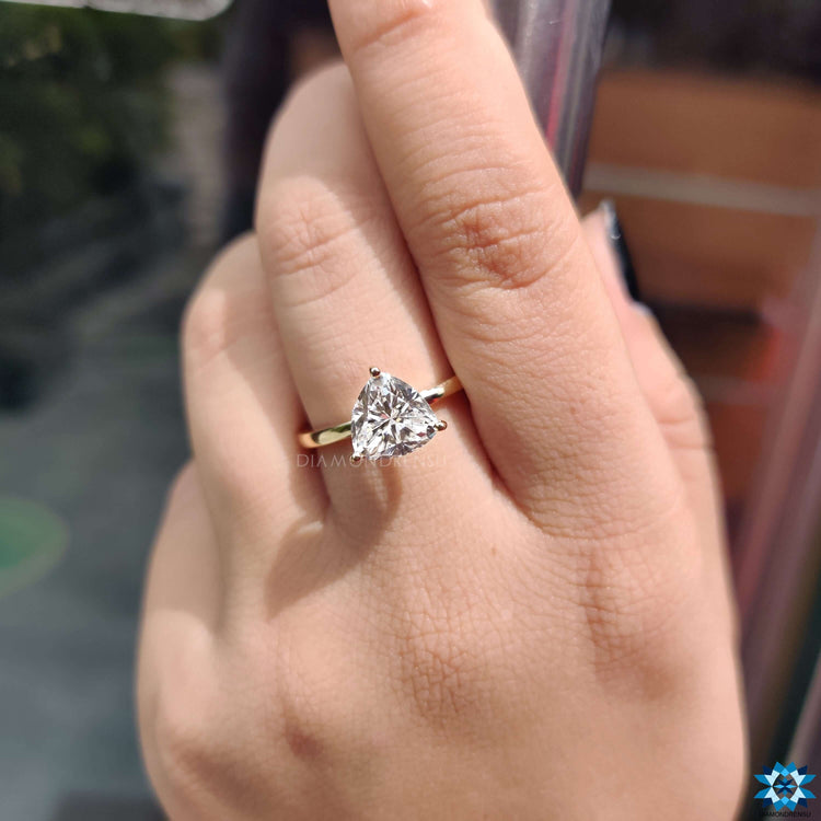 Trillion cut engagement ring with solitaire design.
