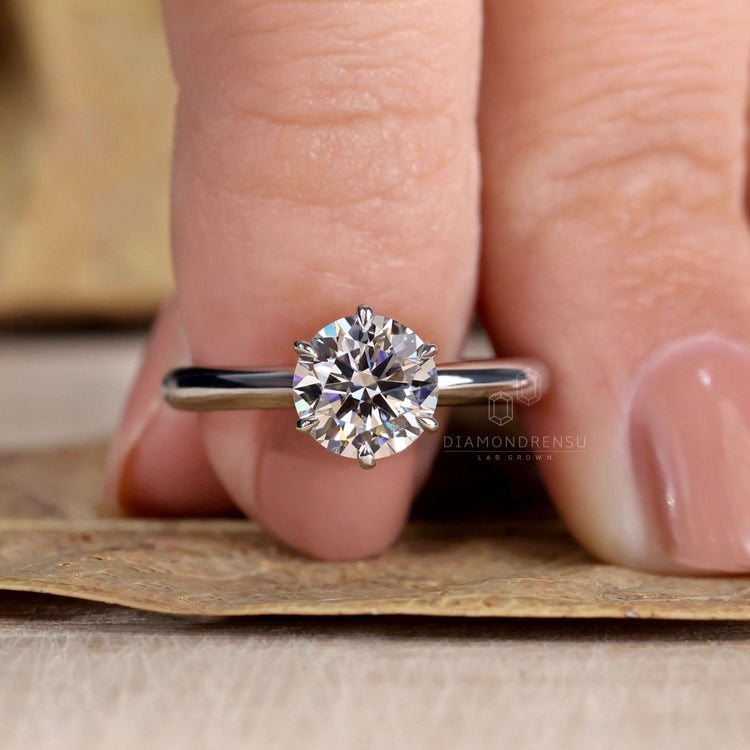Round Diamond Solitaire Ring offering a classic design with ultimate sparkle.