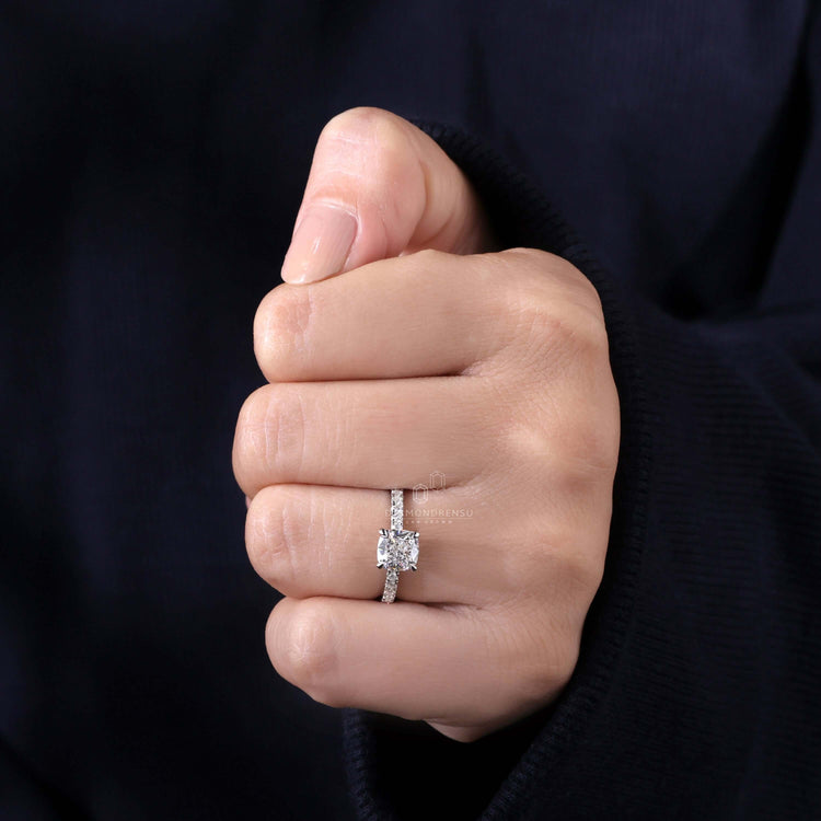 Cushion ring featuring a 4 prong claw setting paired with pave diamonds for unmatched brilliance and charm.
