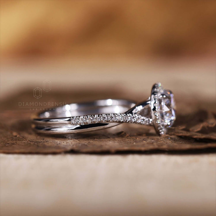 Engagement ring with pave band crafted in white gold.
