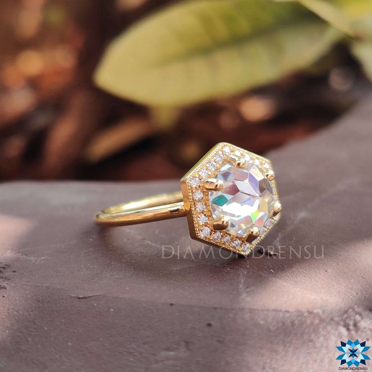 Yellow gold ring with rose cut moissanite.
