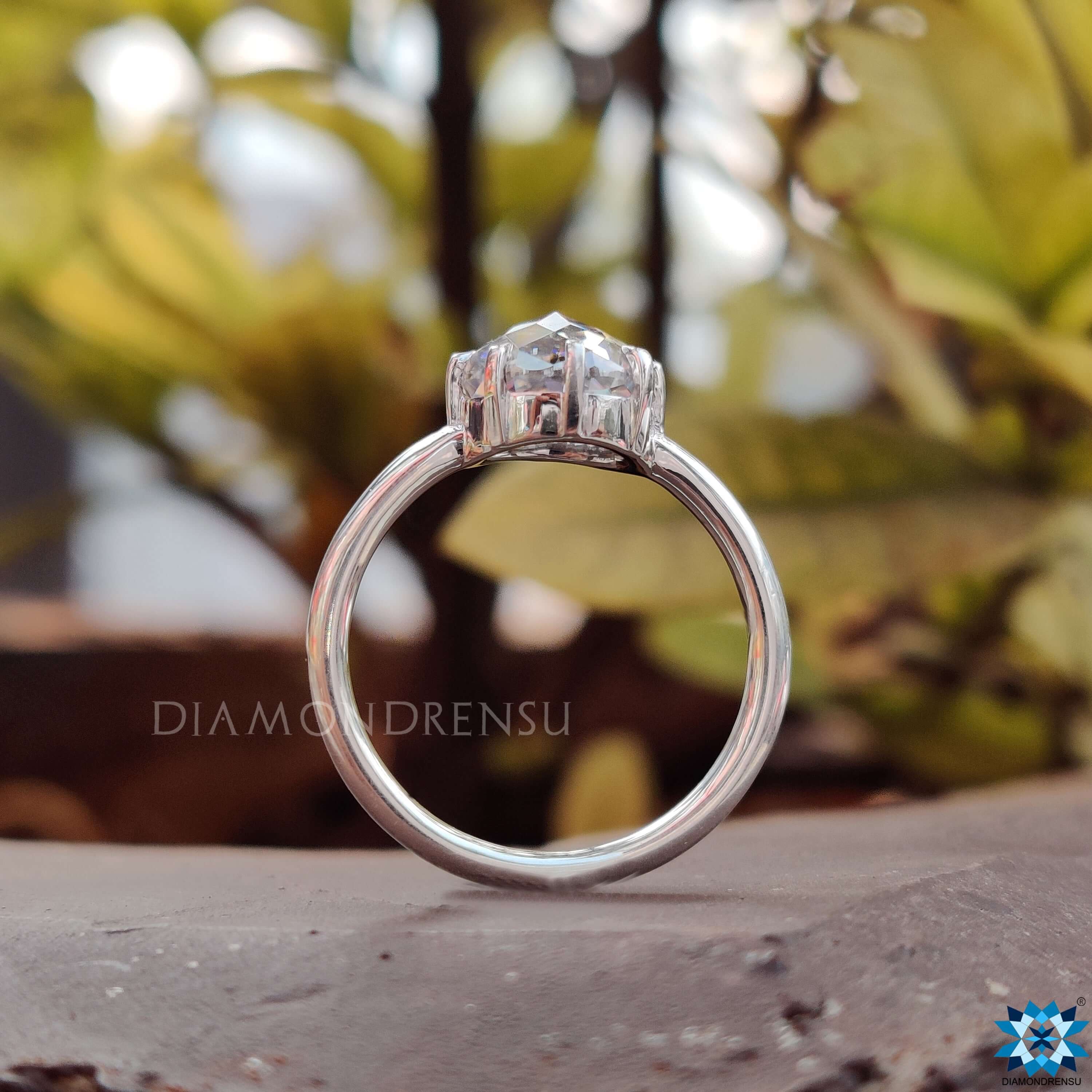 White gold engagement ring with a dazzling round solitaire engagement ring centre.