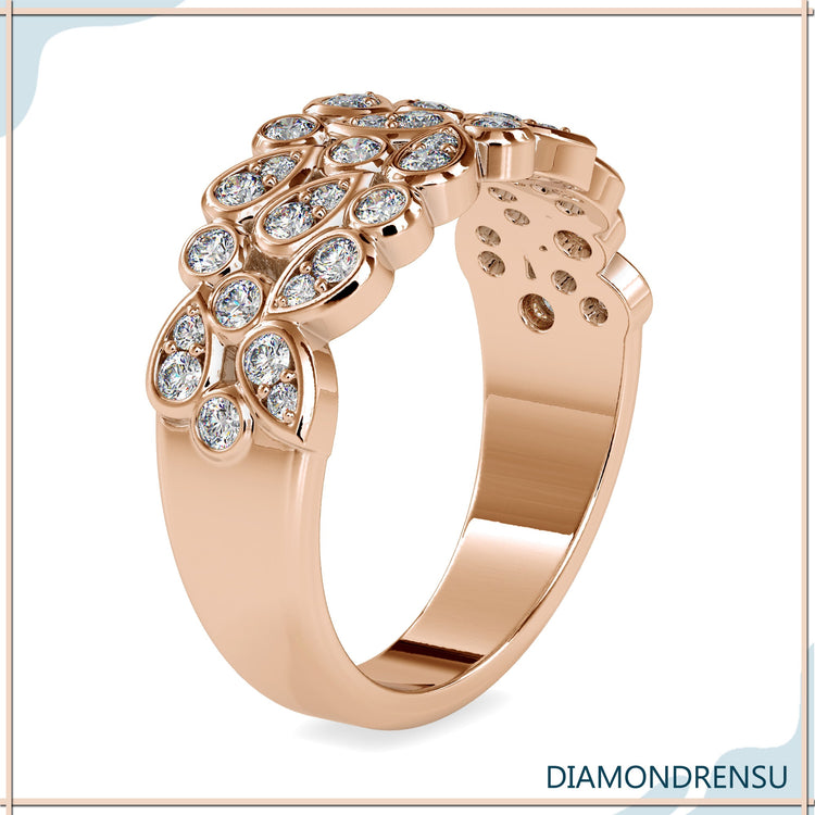 Gold wedding band designed with bezel set diamonds.
