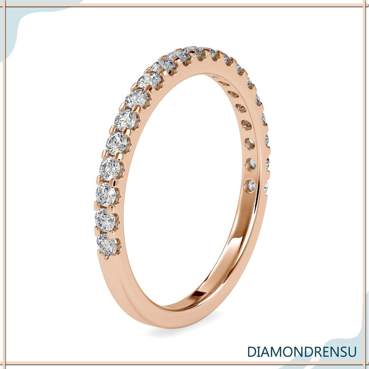 UK wedding band with French pavé half eternity layout.
