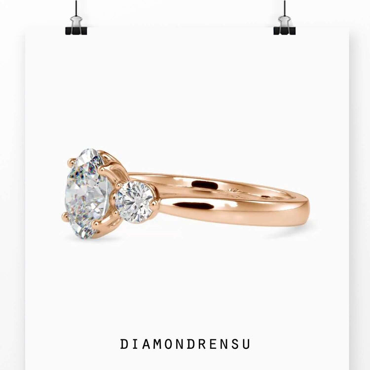 Oval diamond ring with 4 round prong setting.
