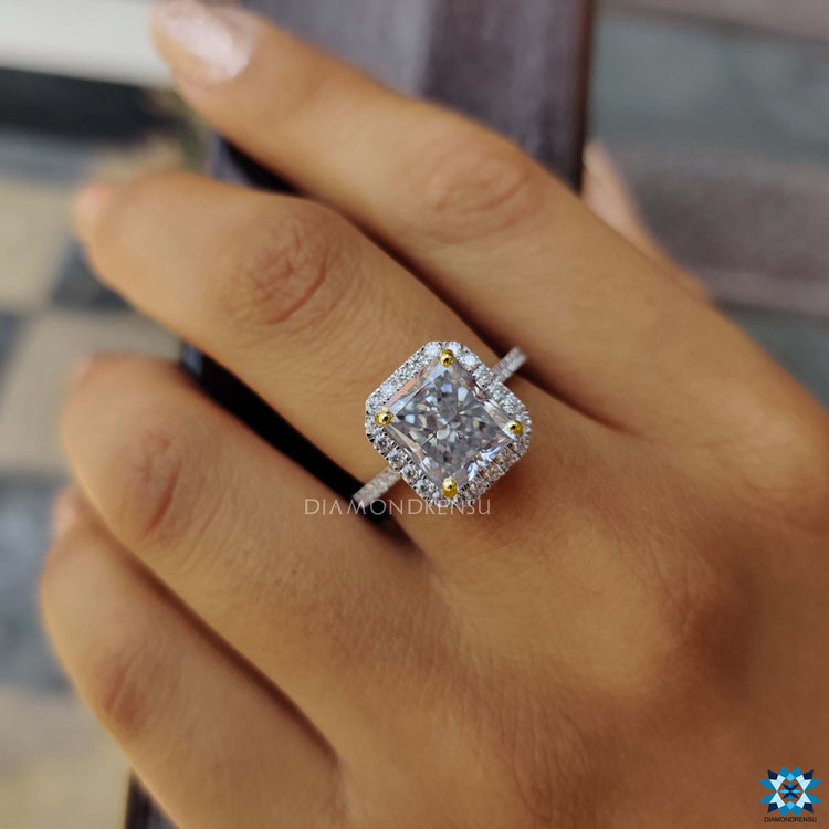Two-tone moissanite ring in white and yellow gold.
