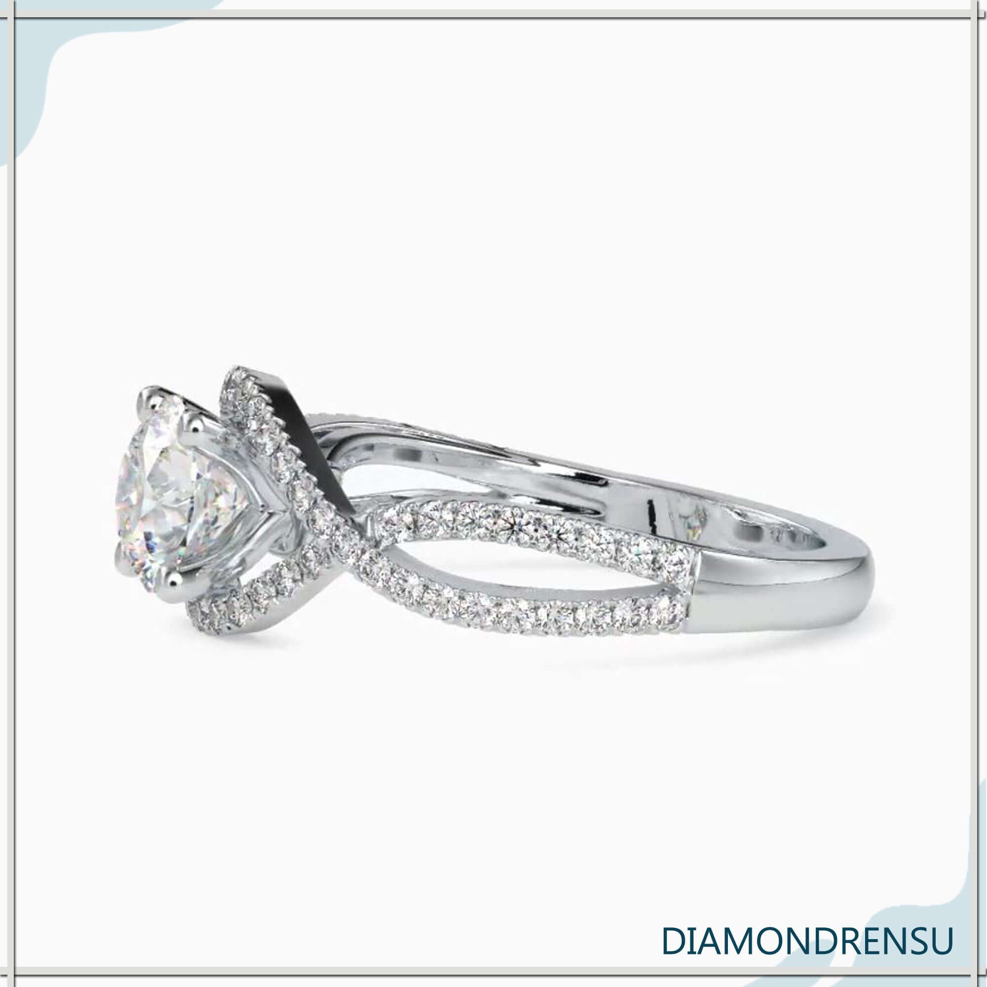 Twisted ring with a 1 carat round diamond and a 4 prong round engagement ring setting.
