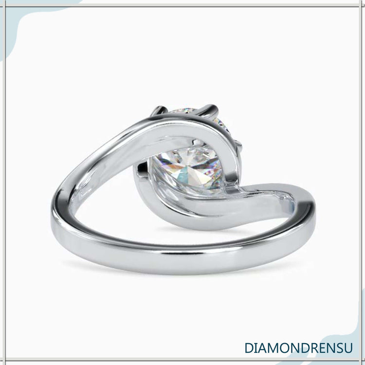 Custom design ring with 6 prong setting and round cut.
