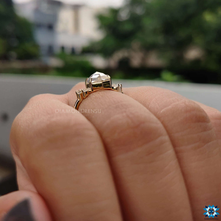 Yellow gold rose cut moissanite ring in 4 prong claw mount.

