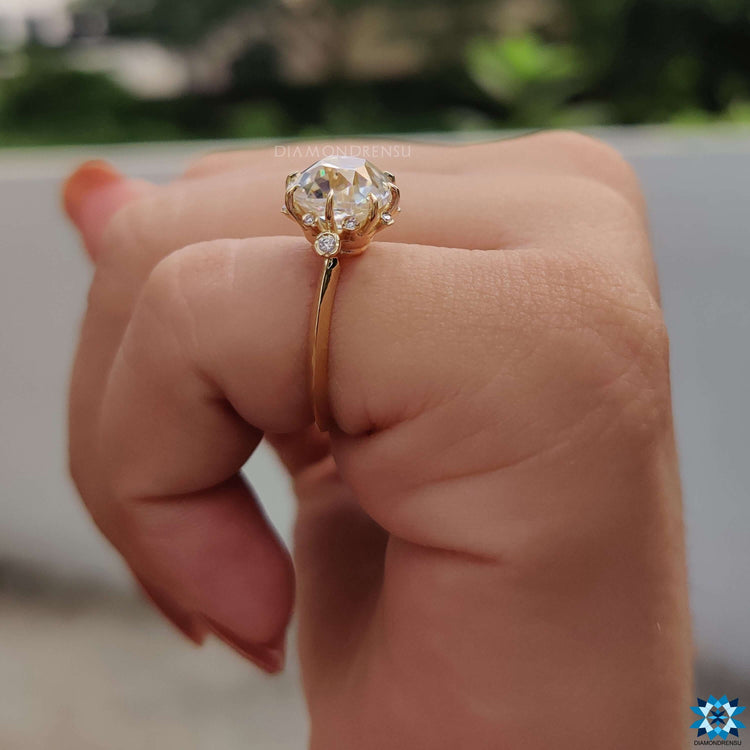 Muse design ring featuring cushion cut moissanite.
