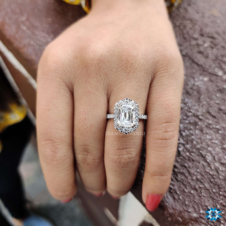 Custom engagement ring with round cut halo and peekaboo design.
