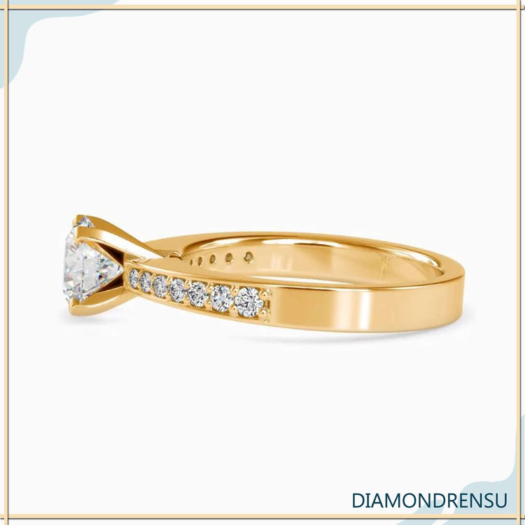 4 prong ring showcasing an IGI certified round diamond on a sleek band.
