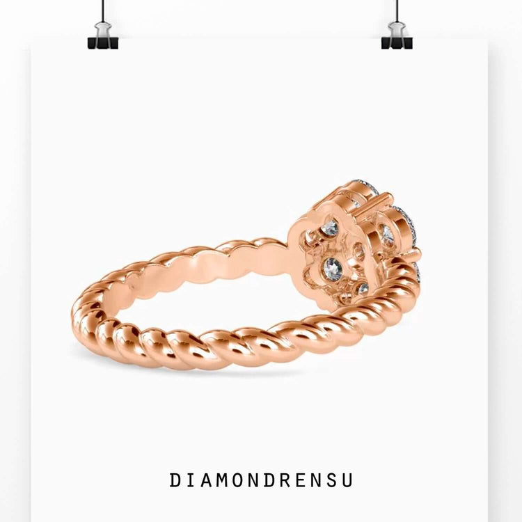 IGI certified round diamond ring with twisted band in rose gold.
