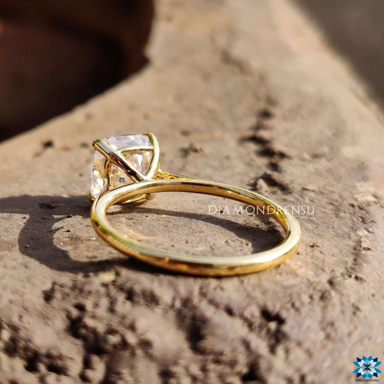 Handmade cushion cut engagement ring with prong setting.
