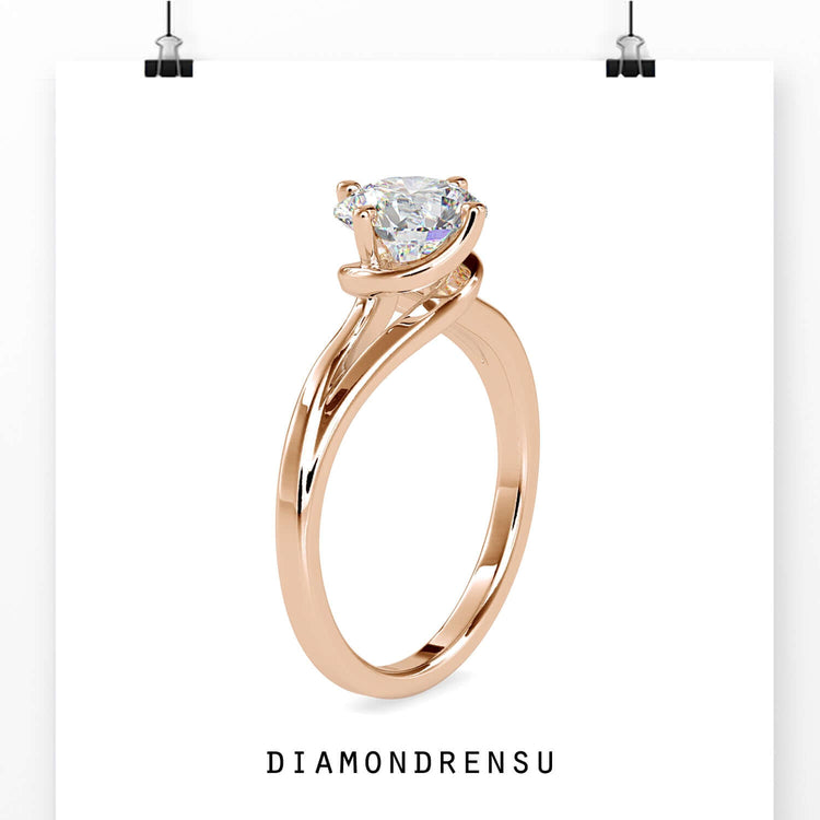 Rose gold ring with round cut solitaire diamond, UK crafted.
