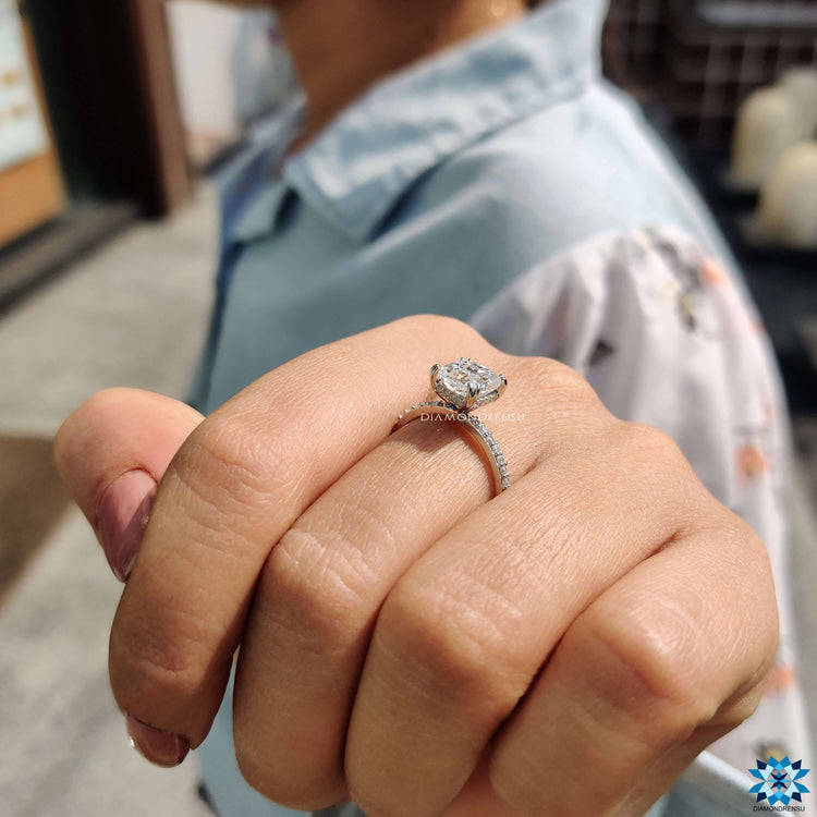 White gold moissanite ring with double prong setting.

