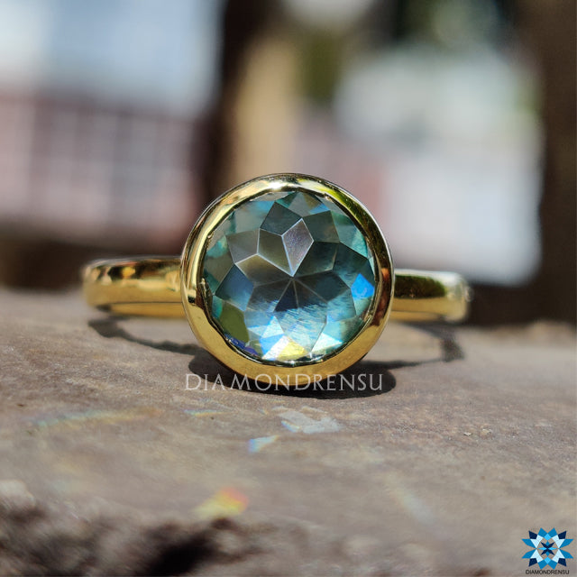 Buy engagement ring with rose cut moissanite in clean gold bezel.
