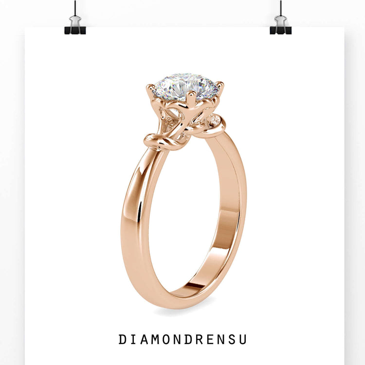 Custom engagement ring in rose gold with round cut diamond.
