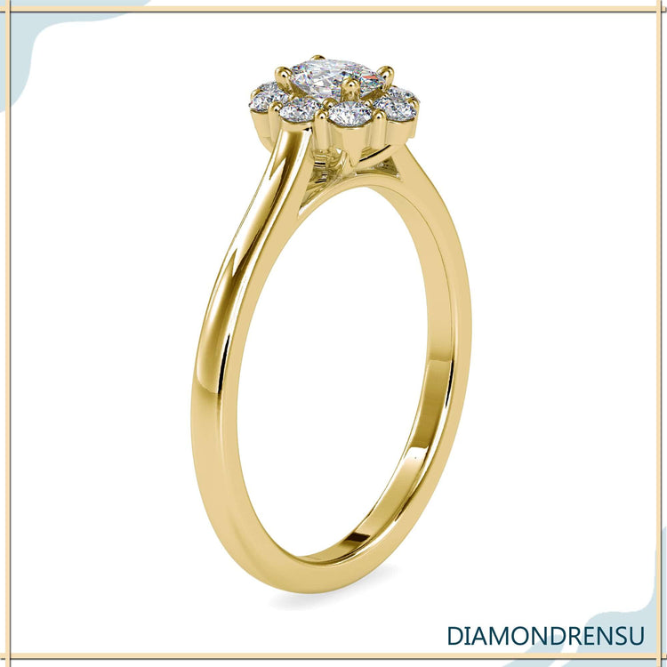 Cluster oval engagement ring in white gold with cathedral band.
