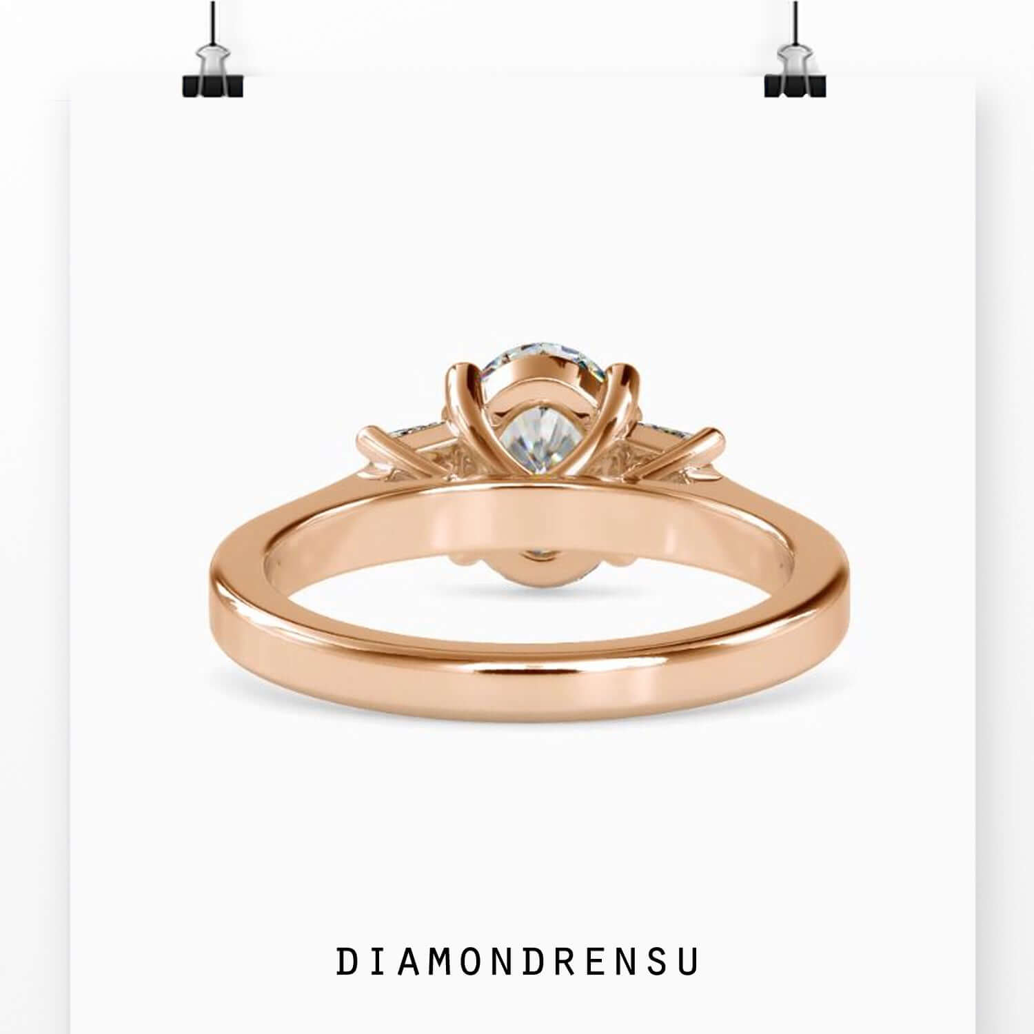 Basket setting diamond ring with trapezoid side stones.