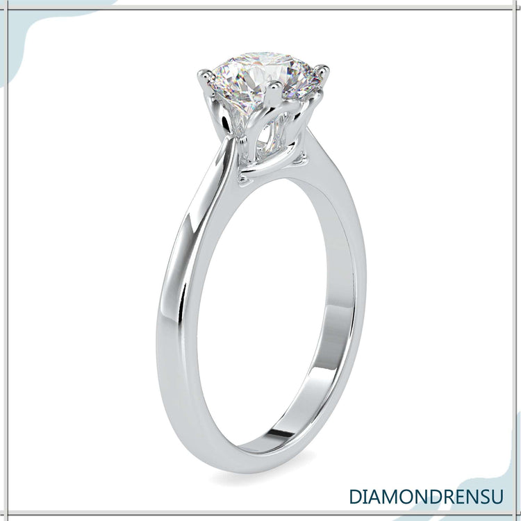 Buy diamond ring in UK with designer round cut and 4 prong.
